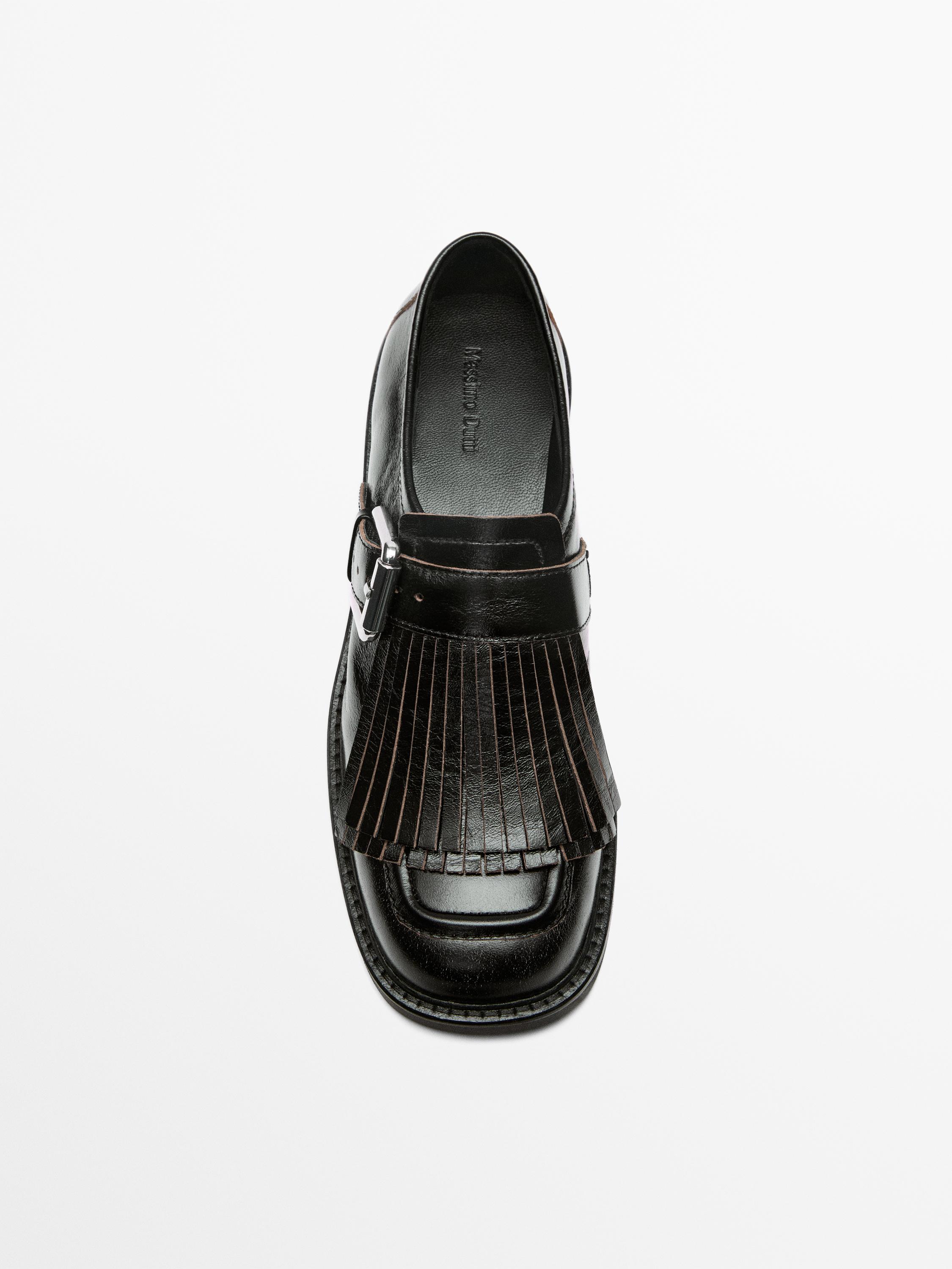 Buckled derby shoes with fringe